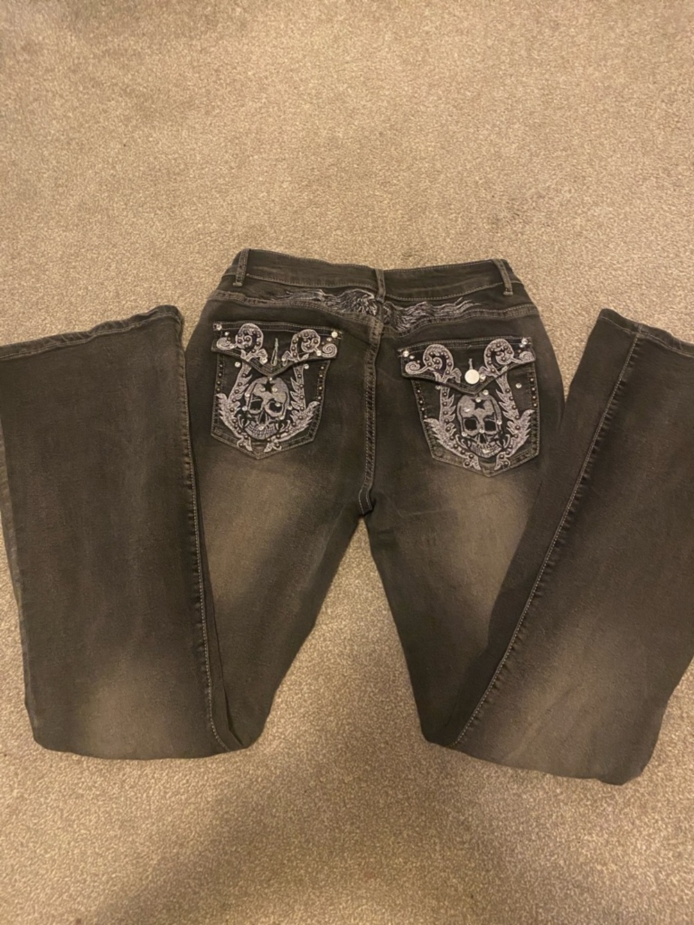 Rhinestone skull embroidered flare jeans